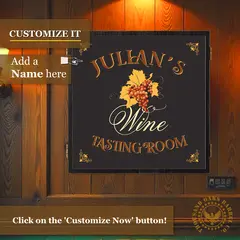 Custom wine tasting room dartboard cabinet mounted on wood wall with personalized name and grape design, featuring “Customize It” name option.