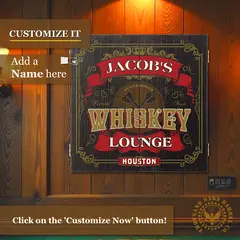 Personalized Whiskey Lounge dartboard cabinet with custom name printed on woodgrain doors mounted on wall.