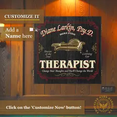 Personalized therapist dartboard cabinet mounted on wooden wall with custom name and professional credentials