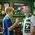Father and son enjoying personalized soccer dartboard cabinet in soccer themed game room