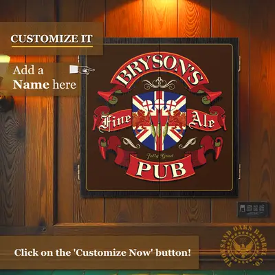 Custom name English pub dartboard cabinet mounted on wood-paneled wall, displaying “Bryson’s Fine Ale Pub” design with Union Jack crest and banner details, shown with “Customize It” callout.