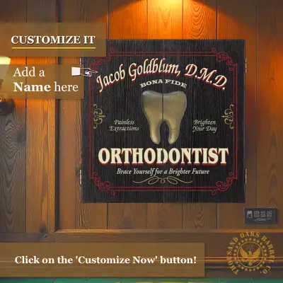 Personalized Orthodontist dartboard cabinet mounted on wood wall with custom name option displayed