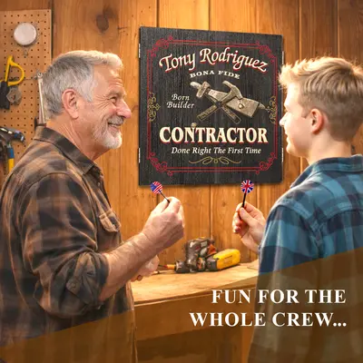 Father and son playing darts in workshop with personalized contractor dartboard cabinet featuring custom name design