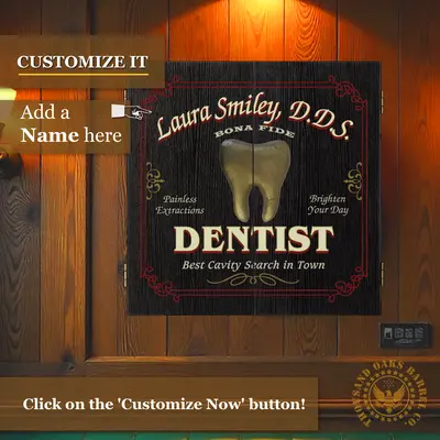 Personalized dentist dartboard cabinet mounted on wall showing custom name option and vintage dental-themed artwork.