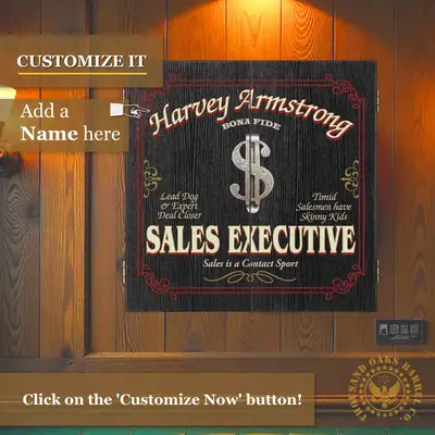 Personalized Sales Executive dartboard cabinet mounted on wood wall showing custom name placement area and vintage executive design.