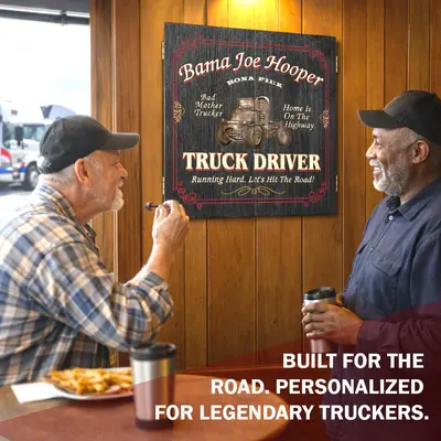 Two truck drivers playing darts in a break room with a personalized truck driver dartboard cabinet mounted on the wall, custom name design reading “Truck Driver – Running Hard. Let’s Hit The Road!”